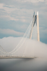 Yavuz Sultan Selim Bridge emerging above clouds in Istanbul, Turkey