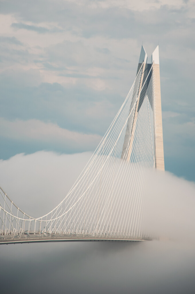 Yavuz Sultan Selim Bridge emerging above clouds in Istanbul, Turkey